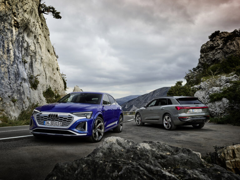 Audi SQ8 Sportback e-tron, Static photo, Colour: Ultra Blue metallic. Audi Q8 55 e-tron quattro, Static photo, Colour: Chronos Gray metallic.