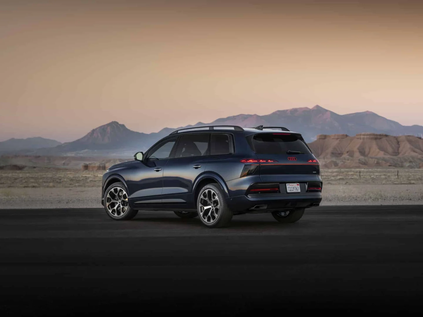 Audi Q9 SUV - Waitomo blue metallic, outdoor static photo, exterior, three-quarter rear view