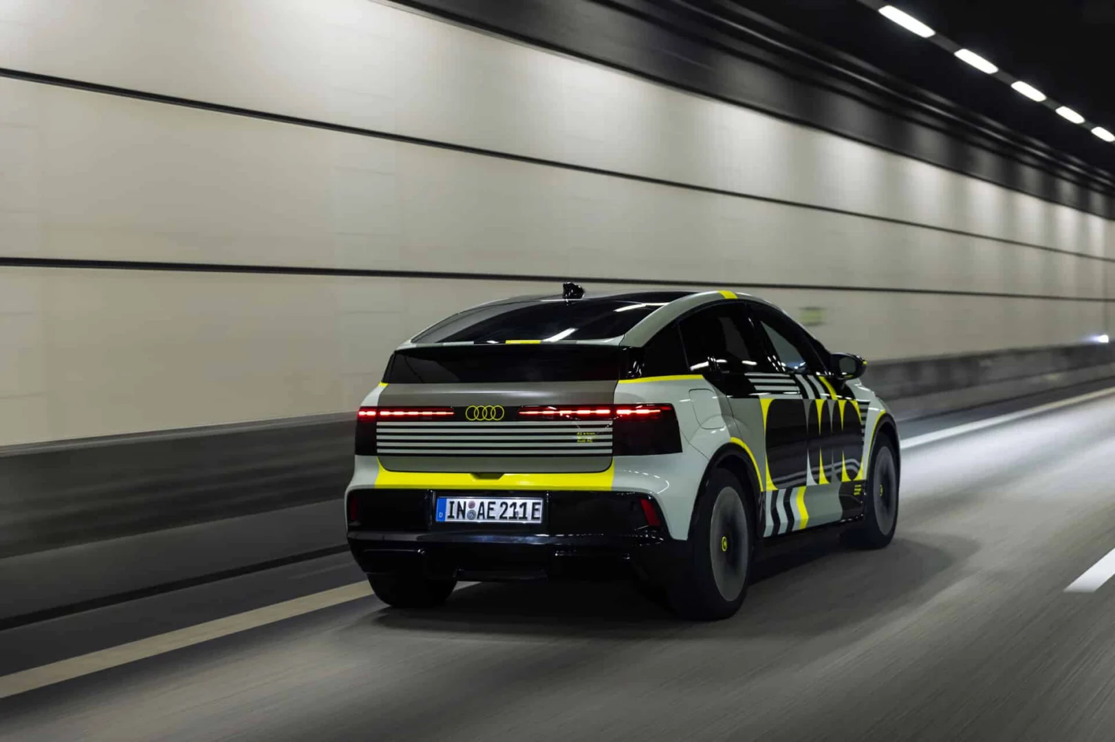 Audi A2 e-tron with design livery - Outdoor driving shot, exterior, three-quarter rear view