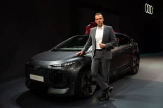 Audi A2 e-tron at the Paris Motor Show - Efficient electric mobility for Europe: Rouven Mohr, Member of the Board of Management for Technical Development at AUDI AG, with the A2 e-tron at the Paris Motor Show